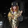 Paloma Faith wearing a Top hat, gold cape and ruby shoes leaves La Caprice after dining with Jools Holland and friends. London.