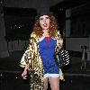 Paloma Faith wearing a Top hat, gold cape and ruby shoes leaves La Caprice after dining with Jools Holland and friends. London.