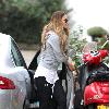 Elle Macpherson takes her children to school London.