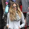 Elle Macpherson takes her children to school London.