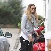 Elle Macpherson takes her children to school London.