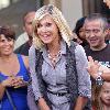 Olivia Newton-John
filming an interview for the entertainment television news programme �Extra� at The Grove in Hollywood.
Los Angeles, California.