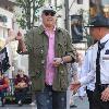 Chevy Chase and Jayni Lukefilming an interview for the entertainment television news programme �Extra� at The Grove in Hollywood. Los Angeles.