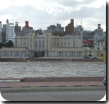 Kitesurfing in Ramirez Beach, Mercosur´s Pro Tempore Secretariat Building in the background. Even in winter Montevideo is a great place for water sports.