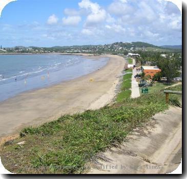 Viewing south over Yeppoon. The orange building is Yeppoon Surf Life Saving. There is a highway just between the beach and the hill that would take you to the Rydges Capricorn Resort and m