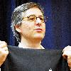 Dan Lyons, aka Fake Steve Jobs, holding up an Apple turtleneck for size at an event at Kepler