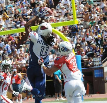 Arizona Cardinals wide receiver Larry Fitzgerald catches a touchdown pass from New Orleans Saints quarterback Drew Brees during the fourth quarter of the National Football League Pro Bowl Feb. 8, 2009, at Aloha Sta