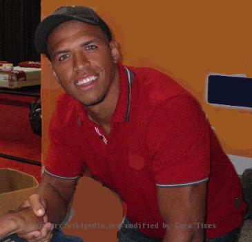 Dallas Cowboys Wide Receiver Miles Austin (#19), publically shaking hands with a fan at the Texas State Fair on September 30th, 2009.  Miles appeared at the Time Warner Cable "Total Digital Home" booth in place of Patrick