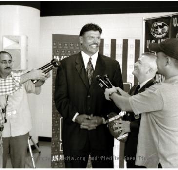 Pro Football Hall of Famer Anthony Muñoz talks with the local San Antonio, Texas media to promote the U.S. Army All-American Bowl (2004). Photo by Peter Rimar.