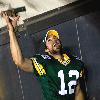 Green Bay Packers starting quarterback Aaron Rodgers runs off Lambeau Field into the tunnel amid a standing ovation.