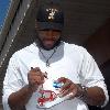 A U.S. Navy Sailor assigned to SEAL Delivery Vehicle Team One receives an autograph from Braylon Edwards, wide receiver for the National Football League’s Cleveland Browns and 2008 American Football Conference Pro Bowl