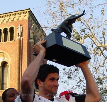 Leinart holding his Heisman trophy at USC