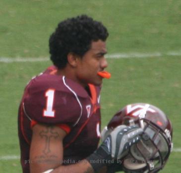 Macho Harris and Cam Martin of the Virginia Tech Hokies walk onto the field