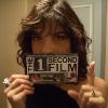 Selma Blair holding a postcard for The 1 Second Film