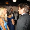 Michelle Hunziker talking to Harry Hamlin on board the Royal Yacht Britannia on the occasion of the bir