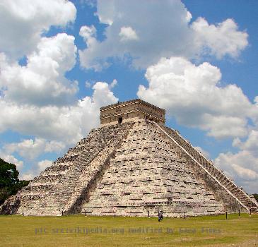 The Castle (El Castillo) at the World Heritage Site Chichen Itza. From the east side you can see both the restored side and the still rather ruinous side of the pyramid.