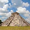 The Castle (El Castillo) at the World Heritage Site Chichen Itza. From the east side you can see both the restored side and the still rather ruinous side of the pyramid.