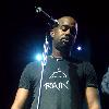 Yokota Air Base, Japan -- Darius Rucker, lead singer of Hootie and the Blowfish, listens to Staff Sgt. Tami Bonne sing "Amazing Grace" during an Operation Pacific Greetings tour concert here May 19. Sergeant Bonne is a vocalis