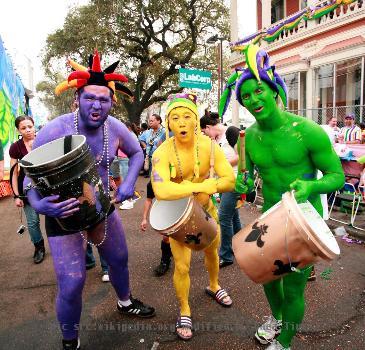 New Orleans Mardi Gras street drummers in the colors of Mardi Gras.