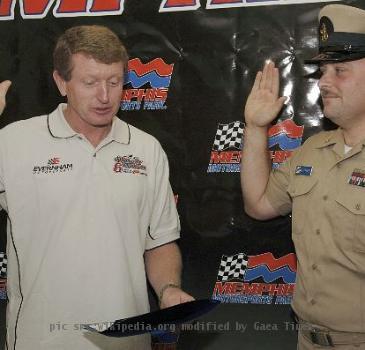 051021-N-3659B-001 Millington, Tenn. (Oct. 21, 2005) - Chief Aviation Ordnanceman Mark Stites takes the Oath of Enlistment read by professional NASCAR driver Bill Elliot at Memphis Motor Sports Park before the Sa