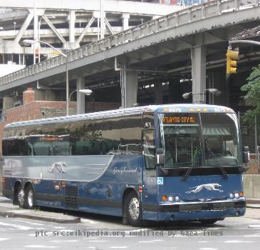 Greyhound Lines Prevost X3-45 #8879, repainted into the latest livery, departs New York City on Schedule 8535.