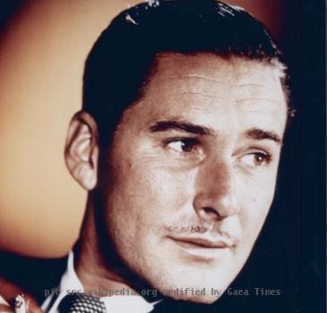 
This image shows a photograph of Errol Flynn, taken ca. 1940. Under Australian law, all photographs taken in Australia before 1955 are in the public domain. This image is in the public domain under both Australian copyright la