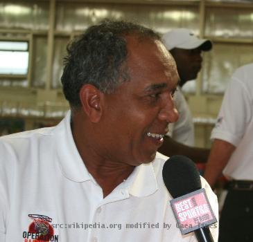 Camp Arifjan, KW - Tubby Smith, University of Kentucky head coach, is interviewed by Leeann Tweeden, "Best Damn Sports Show" correspondent during the Operation Hardwood II basketball tournament May 24 at Camp Arifjan.