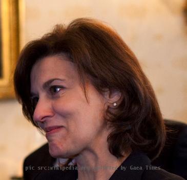 Vicki Kennedy, wife of the late Sen. Edward Kennedy, gives President Barack Obama a "TEDSTRONG" bracelet, which shows support for cancer advocacy, in the Blue Room of the White House prior to the signing ceremony