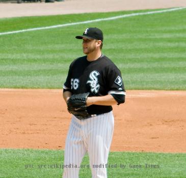 Buehrle takes a sign during his 2009 perfect game.