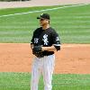 Buehrle takes a sign during his 2009 perfect game.