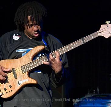 Victor Wooten playing his bass guitar at the