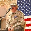 BAGHDAD, Iraq -- Gary LeVox, lead singer for country music group Rascal Flatts, performs for Airmen and Soldiers at Baghdad International Airport on Aug. 5 from a make-shift stage behind a building that was once Saddam Hussein