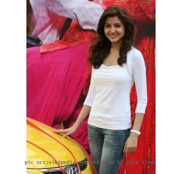 Photograph of Indian actress Anushka Sharma at the contest with the prize (also visible in the image), a Hyundai i10.