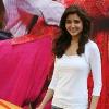 Photograph of Indian actress Anushka Sharma at the contest with the prize (also visible in the image), a Hyundai i10.