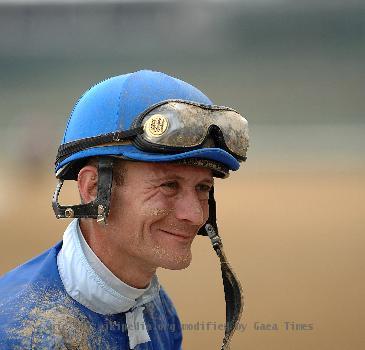 Calvin Borel signing a racing form after a race at Churchill Downs.