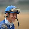 Calvin Borel signing a racing form after a race at Churchill Downs.