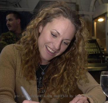 050330-N-8119C-004 Pacific Ocean (Mar. 31, 2005) - Jerri Manthey of the hit television show “Survivor,” signs autographs and talks to crew members aboard the nuclear powered aircraft carrier USS Nimitz (CVN 68). Nimitz is currently conducting Fleet Re