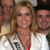 *Caption Tara Connor, Miss USA 2006, takes a moment to pose with members of the 913th Airlift Wing during her visit with the USO of Philadelphia and Southern New Jersey. Miss USA brought smiles to the faces of all those who met her.