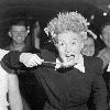 Betty Hutton visits chow halls with sailors and Marines in the Marshall Islands. Peering over the screen star