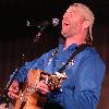 CAMP ARIFJAN, Kuwait – Country music star Darryl Worley performs on camp Thursday in front of more than 2,000 elated servicemembers during the USO Sergeant Major of the Army’s 2006 Hope and Freedom Tour. Worley is tou