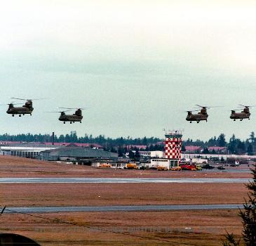 View of four Chinook helicopters over airfield at Ft. Lewis.