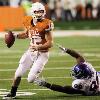 <p>Texas quarterback Colt McCoy  left  evades a tackle by Kansas  Jamal Greene in the second half of an NCAA college football game  Saturday  Nov  21  2009  in Austin  In the 51 20 Texas win  McCoy earned his NCAA record 43rd career victory as a starter  < p>