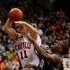 <p>Evansville guard Colt Ryan  left  is fouled by Butler guard Shelvin Mack while going up for a shot during the second half of an NCAA college basketball game in Evansville  Ind   Saturday  Nov  21  2009  Butler won 64 60   AP Photo Darron Cummings  < p>