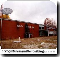 mentioning the trio of stations that bear that famous call sign  and we re happy to share some photos of all three WOODs in this installment of Tower Site of the Week  We ll start just north of the WWMT WBCT site that we saw in last week s installment  Grand Rapids  WOOD TV  Channel 8  built its tower halfway between Grand Rapids and