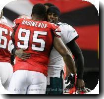 <p>Philadelphia Eagles Michael Vick  right  hugs former teammate Jonathan Babineaux  95  during the coin toss before an NFL football game Sunday  Dec  6  2009  in Atlanta  Vick  who previously played quarterback for Atlanta  was playing for the first time since serving a prison sentence for dogfighting  < p>
