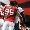 <p>Philadelphia Eagles Michael Vick  right  hugs former teammate Jonathan Babineaux  95  during the coin toss before an NFL football game Sunday  Dec  6  2009  in Atlanta  Vick  who previously played quarterback for Atlanta  was playing for the first time since serving a prison sentence for dogfighting  < p>