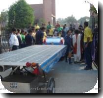 The solar taxi at the Sanskriti School Louis Palmer and Nobel prize winner