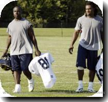 Rams running back Marshall Faulk  left  and the team s first round draft choice  Steven Jackson  leave the field following a discussion between the two after the Rams  evening practice session