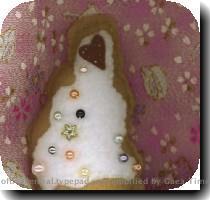 More cupcake softie goodies found on etsy  This one s from Three Wishes Design   I love the pearls and the wavy shape  And the fabric in the background is pretty too  This designer also has