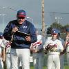 system and the players  who range from promising prospects in their late teens to those who have had a number of years in the big leagues  are paid professionals  Left  Coach Ken  Shorty  Ames presents the All American Invitational MVP award to catcher Brandon Marcelli Making it to the  Show  Although it is a long way